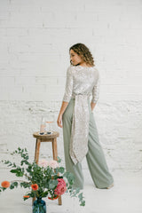 Two-Piece Wedding Guest Outfit with Multi-Position Sequin Top and Green Palazzo