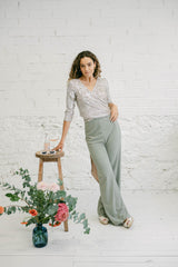 Two-Piece Wedding Guest Outfit with Multi-Position Sequin Top and Green Palazzo