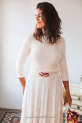 Vestido de novia de encaje rosa cuarzo con manga