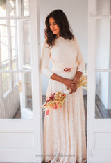 Vestido de novia de encaje rosa cuarzo con manga