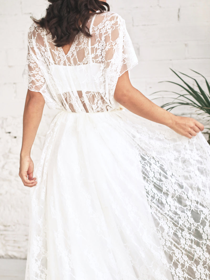 Wedding dress with sweetheart neckline and lace overdress