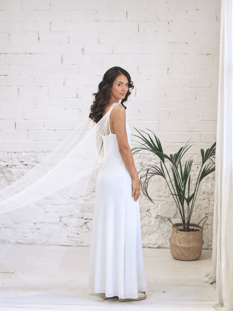 Long white sequin dress with bridal wings